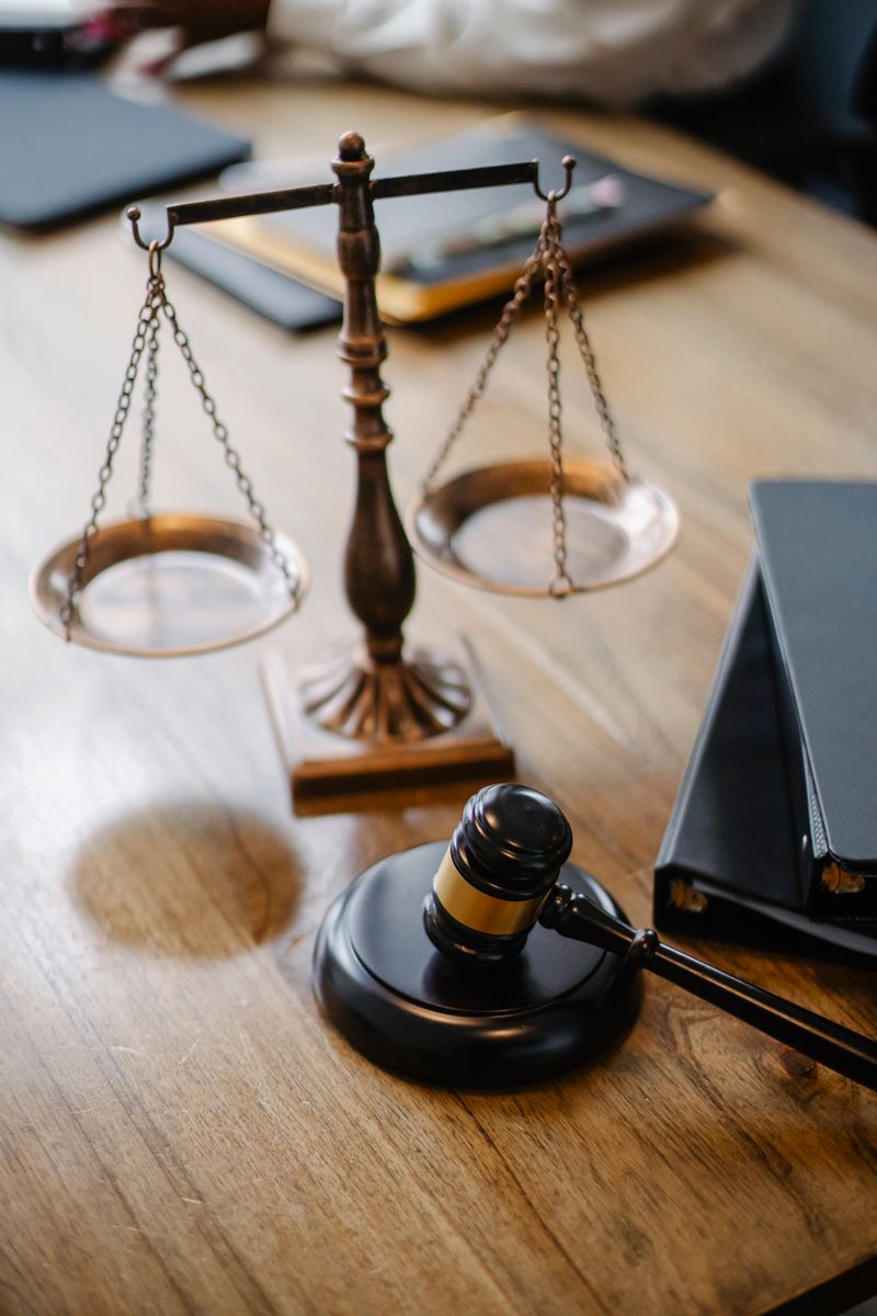 Lawyers’ desk with decorative scales of justice and a gavel