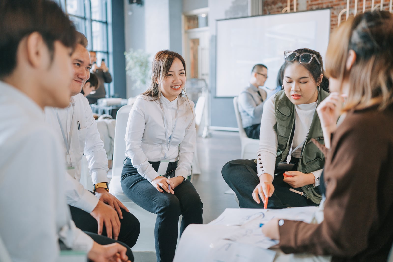 Creative team collaborating around a table in a modern workspace